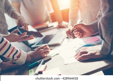 Team work process. Marketing strategy brainstorming. Paperwork and digital in open space. Intentional sun glare - Shutterstock ID 428964418