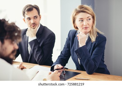 Team work process. young business managers crew working with new startup project. laptop on wood table, typing keyboard, texting message, analyse graph plans. - Shutterstock ID 725881219