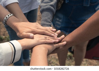 Team work put hands together. friends team concept