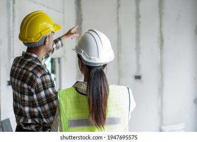 Team of worker inspector or engineers is checking inspecting and discussing plan to renovation the building or house. Inspection and Engineering concept