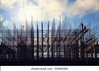 Team Of  Workers Building Pile With Blue Sky On The Backgrounds. New Skyscraper.