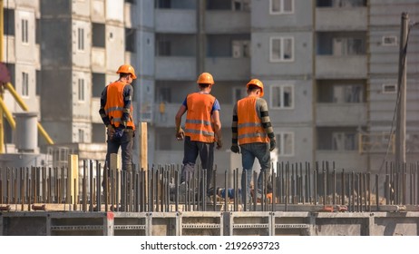 Team of workers doing electrical installation. Fast motion of buidling construction workers installing a wire. - Shutterstock ID 2192693723