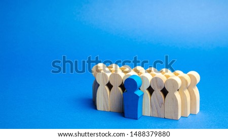 A team of workers on a blue background. The concept of personnel selection and management within the team. Dismissal and hiring people to work. Human Resource Management. Headhunting. Talented worker