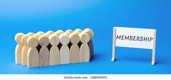 Team of workers and a poster with the word membership. Belonging of people to the organization, society, association. Business concept, teamwork