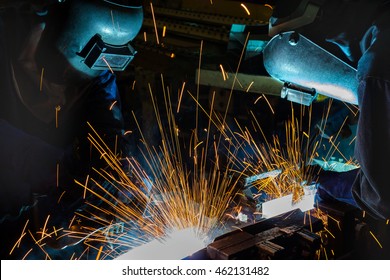 Team workers are welding steel part in factory
 - Shutterstock ID 462131482