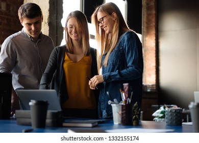 The team is working on a project in a modern office. - Shutterstock ID 1332155174