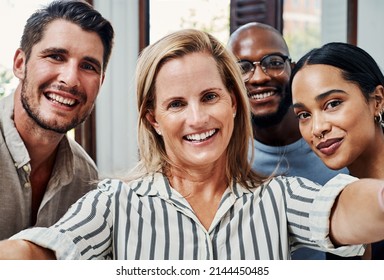 The Team You Need. Cropped Portrait Of A Group Of Business Colleagues Taking Selfies In The Office.