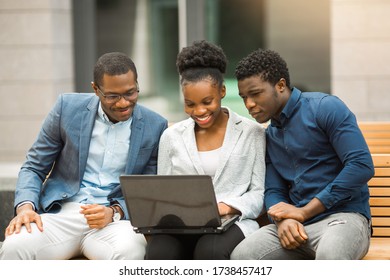 Team Of Young African People Men And Women With Laptop