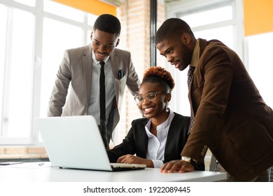 team of young african people in office at table with laptop  - Shutterstock ID 1922089445