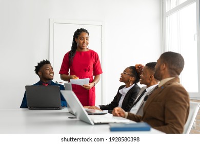 Team Of Young African People In The Office At The Table With A Laptop 