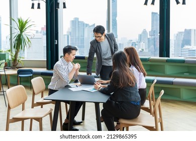 Team Of Young Asian Entrepreneur Have Small Team Meeting For Upcoming Project For Marketing And Sale Management With Skyscraper View For Business Startup And Education