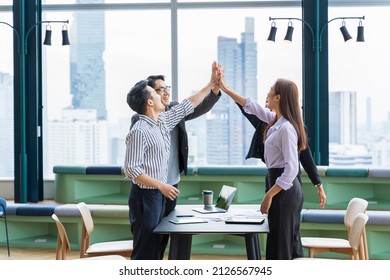 Team of young Asian entrepreneurs and startup have business meeting and encouraging each other for good energy to accomplish successful marketing plan - Shutterstock ID 2126567945