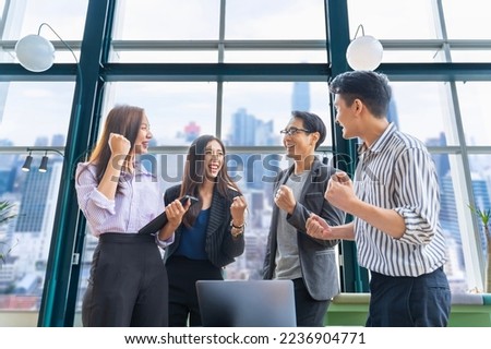 Team of young Asian entrepreneurs and startup have business meeting and encouraging each other for good spirit energy to accomplish successful marketing plan concept
