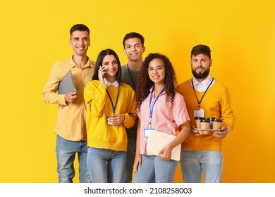 Team Of Young Business People On Yellow Background