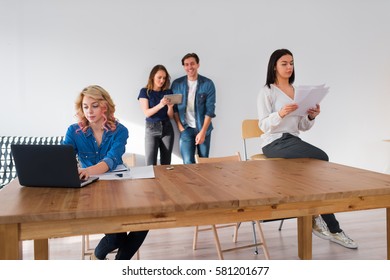 Team Of Young Coworkers Working At Open Space Office. It's A Great Work Environment