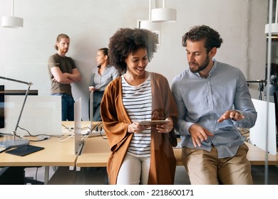 Team of young creative marketing experts brainstorming during work - Shutterstock ID 2218600171