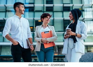 A Team Of Young And Diverse Business People Are Outside And Chatting