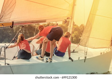 The Team Of Young Girls Takes Part In Sports Competitions, Regatta On Sailing Yachts.  Recreational Water Sports, Extreme Sport Action. Healthy Active Lifestyle. Summer Fun Adventure.