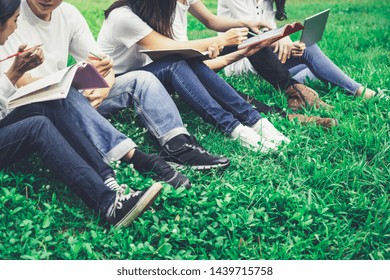 Team Of Young Students Studying In A Group Project In The Park Of University Or School. Happy Learning, Community Teamwork And Youth Friendship Concept.