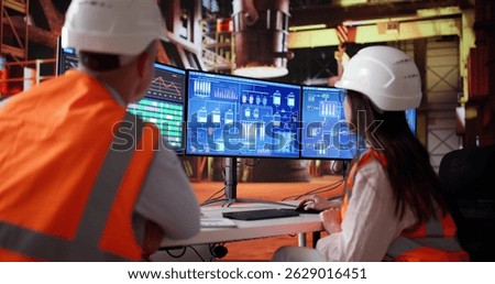 Team Of Young Workers Utilizing Automation System At Steel Factory