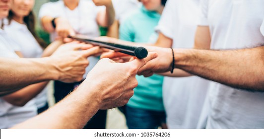 Teambuilding Activity With Stick And Hands