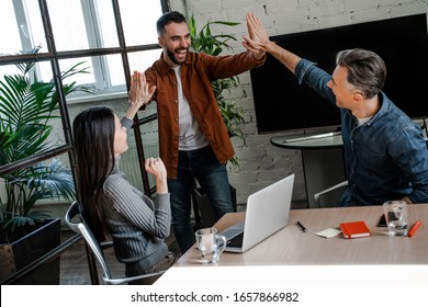 Team-building process in office, take a five, good work, teamwork process. Successful business strategy plan concept. Confident office worker indoor in coworking space. People lifestyle