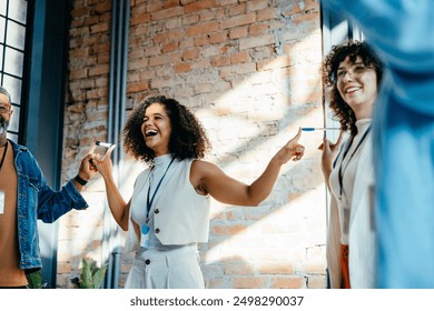 Teambuilding workshop in a modern workspace focusing on building confidence and trust amongst diverse team members through engaging activities - Powered by Shutterstock