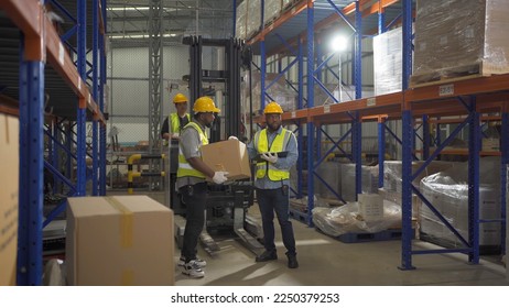 Teamwork of black workers working in large warehouse store industry.Rack of stock storage. Interior of cargo in ecommerce and logistic concept. Depot. People lifestyle. Shipment service for container - Shutterstock ID 2250379253