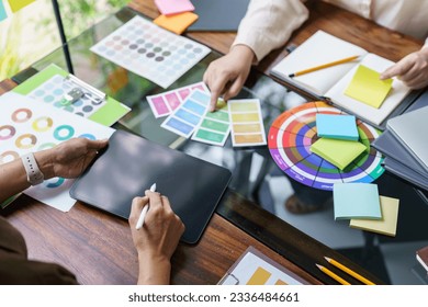 Teamwork brainstorming Creative idea Business project. Business People meeting taking notes while discussing with Color swatch samples to share idea. - Powered by Shutterstock