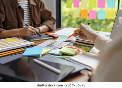 Teamwork brainstorming Creative idea Business project. Business People meeting taking notes while discussing with Color swatch samples to share idea. - Powered by Shutterstock