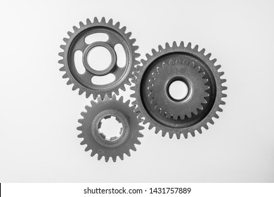 Teamwork business concept - top view of 3 metal gear isolated on white background for mockup. real photo, not 3D render