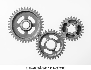 Teamwork business concept - top view of 3 metal gear isolated on white background for mockup. real photo, not 3D render