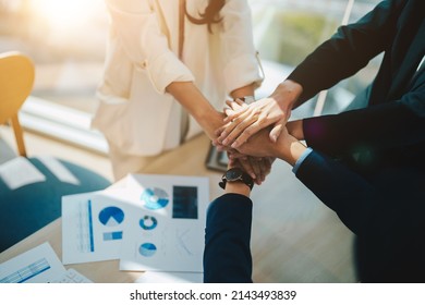 Teamwork business join hand together concept, Business team standing hands together, Volunteer charity work. People joining for cooperation success business - Shutterstock ID 2143493839