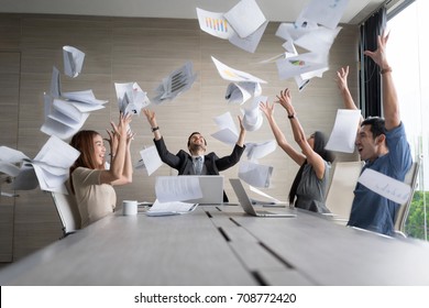 Teamwork business people excited happy smile, throw papers and documents fly in air. Success team concept after sign contract.In selective focus and motion blur moving with perspective view. - Shutterstock ID 708772420