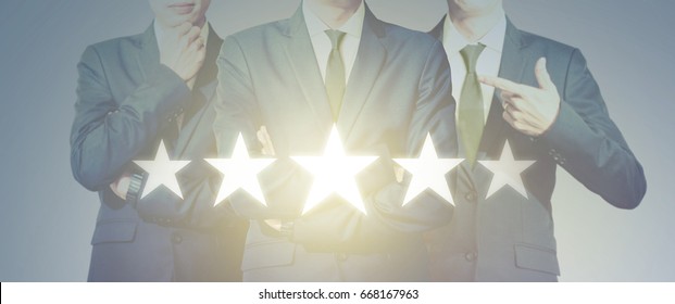 Teamwork Of Businessman Look At Five Star Symbol Increase Rating, Leadership Teamwork Excellence Concept.