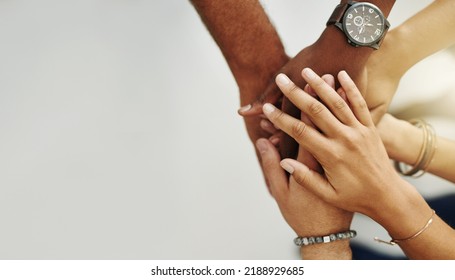 Teamwork, collaborate and support with community joining hands for motivation. Diverse team collaboration and linking partnership with a vision or idea, gesture of global unity, trust and solidarity - Shutterstock ID 2188929685