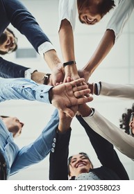 Teamwork, collaboration and unity between business people with their hands stacked for project development and innovation. Group of corporate colleagues united, joining or working together from - Shutterstock ID 2190358023
