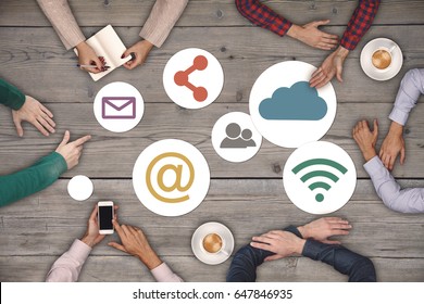Teamwork concept - top view of six creative people working Social Media Icon Concept