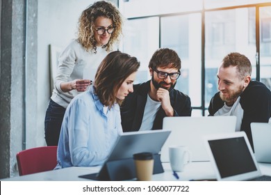 Teamwork Concept.Young Creative Coworkers Working With New Startup Project In Modern Office.Group Of Three People Analyze Data On Desktop Computer.Horizontal,blurred Background