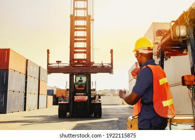 Teamwork, control workers work on cranes, loading intermediate container boxes, ordering trucks, moving containers to keep organized, transport, import and export, cargo freight logistics.