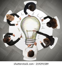 Teamwork draws a big idea during a meeting