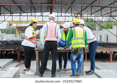 Teamwork executives and supervisor civil engineer review the work and talk about how the project, Prefabricated house factory construction site, Precast concrete wall panel,  - Powered by Shutterstock