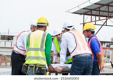 Teamwork executives and supervisor civil engineer review the work and talk about how the project, Prefabricated house factory construction site, Precast concrete wall panel,  - Powered by Shutterstock