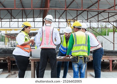 Teamwork executives and supervisor civil engineer review the work and talk about how the project, Prefabricated house factory construction site, Precast concrete wall panel,  - Powered by Shutterstock