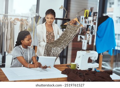 Teamwork, fashion designer or women with dress in small business for order, ideas or creative clothes. Tablet, stylist or people planning in startup agency for boutique, modern style or fabric piece - Powered by Shutterstock