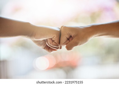 Teamwork, fist bump and motivation, collaboration and success for goals, trust and support. Closeup friends, greeting hands and team building, commitment and winner, solidarity and fighting racism