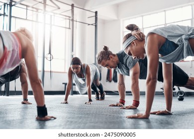 Teamwork, fitness class and workout with push ups in gym for arm strength, healthy body and exercise. Training collaboration, people and muscle challenge for core, weightloss and physical activity - Powered by Shutterstock