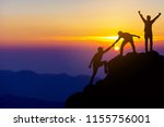 Teamwork friendship  hiking help each other trust assistance silhouette in mountains, sunrise. Teamwork of two men hiker helping each other on top of mountain climbing team beautiful sunrise landscape