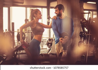 Teamwork in gym. Couple working exercise together. - Powered by Shutterstock