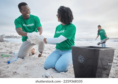 Teamwork, happy and recycling with people on beach for sustainability, environment and eco friendly. Climate change, earth day and nature with volunteer and plastic for help, energy and pollution - Powered by Shutterstock